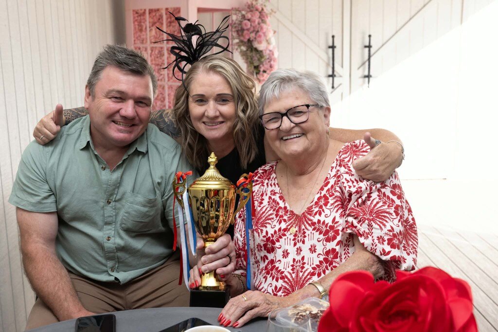 Best dressed winners celebrating with the Melbourne Cup trophy