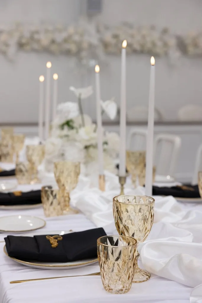 Gold vintage wine and water glasses on a wedding table at White Barn Pokolbin