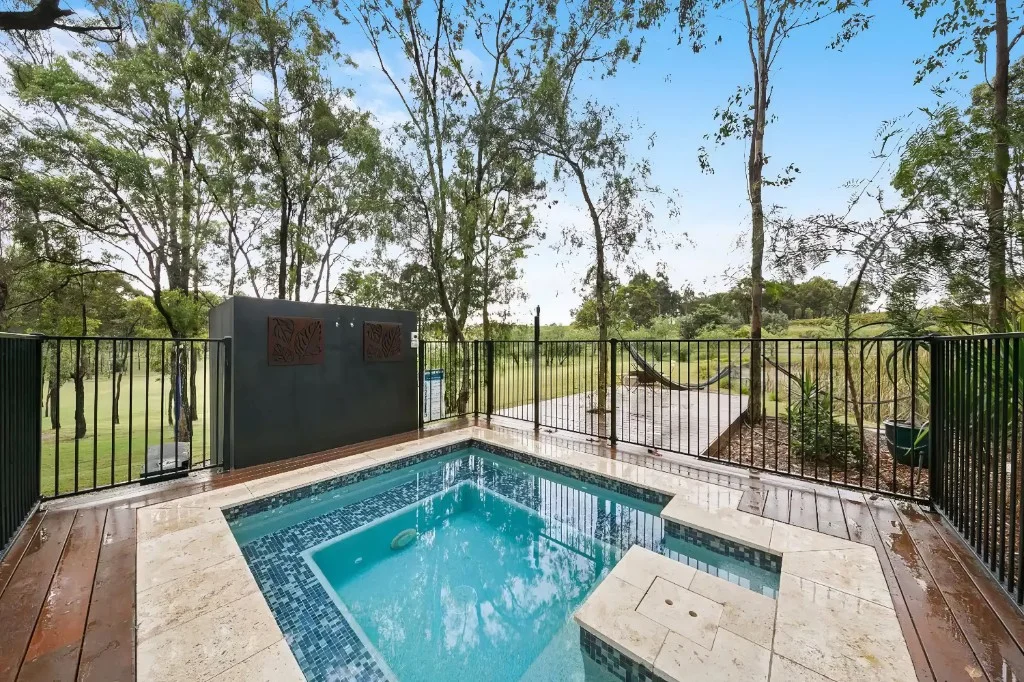 Plunge pool on the guest house deck surrounded by bushland