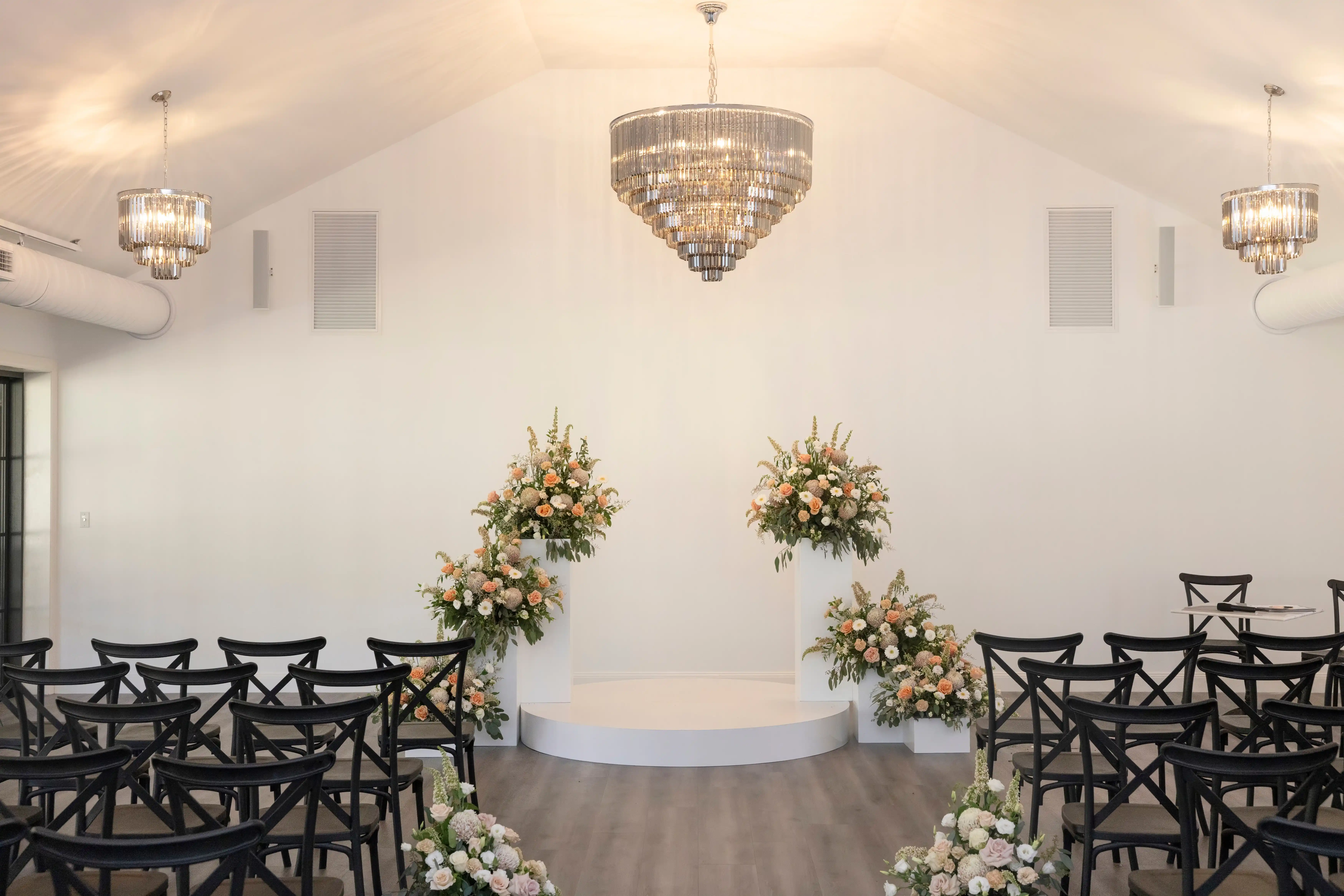 Chapel ceremony with vineyard views through floor-to-ceiling windows at White Chapel